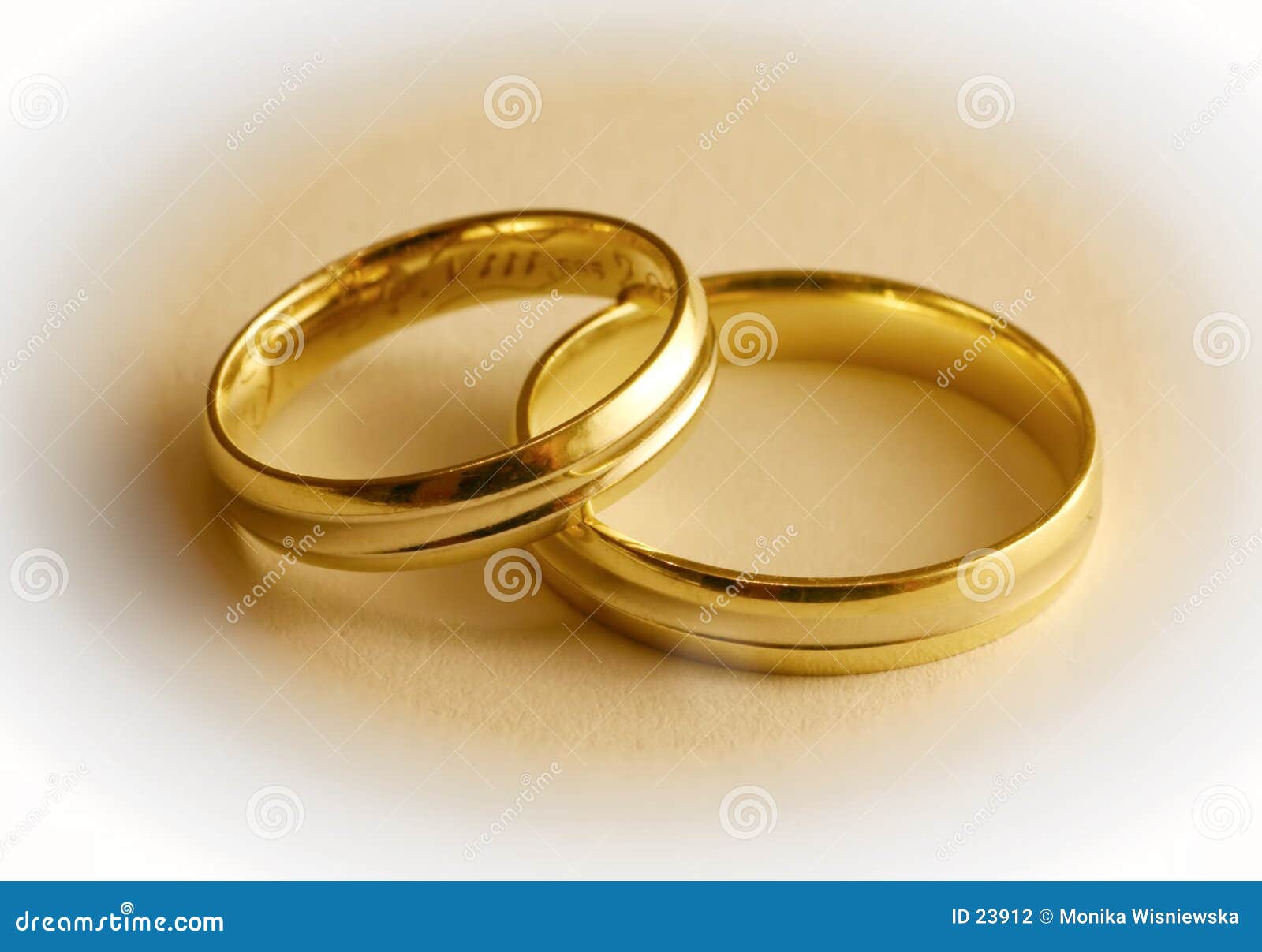 Two wedding rings. The lower part of the rings is in focus the upper ...