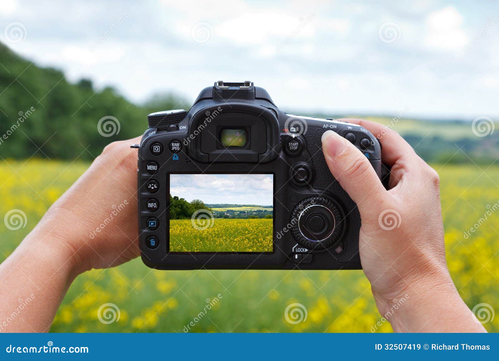 using dslr camera to take photo woman looking rear lcd screen compose landscape her liveview 32507419