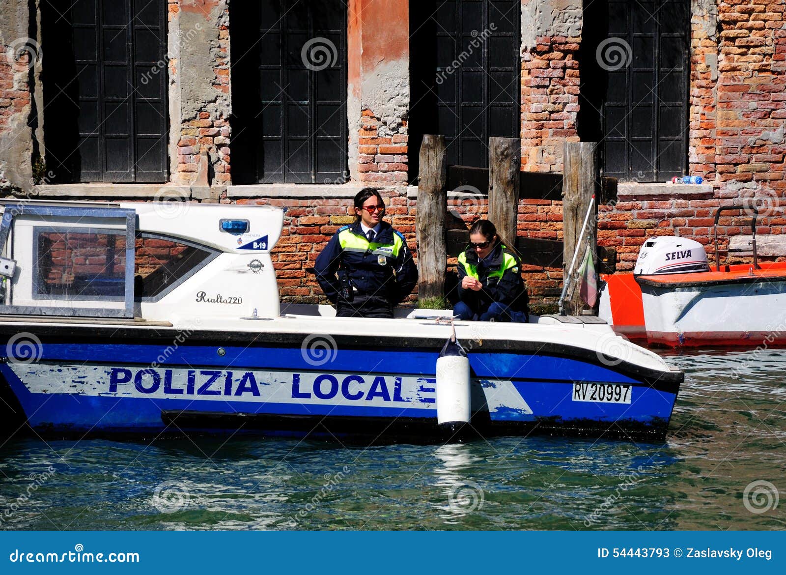 VENICE, ITALY- APRIL 3, 2015: Two police women are on duty on their 