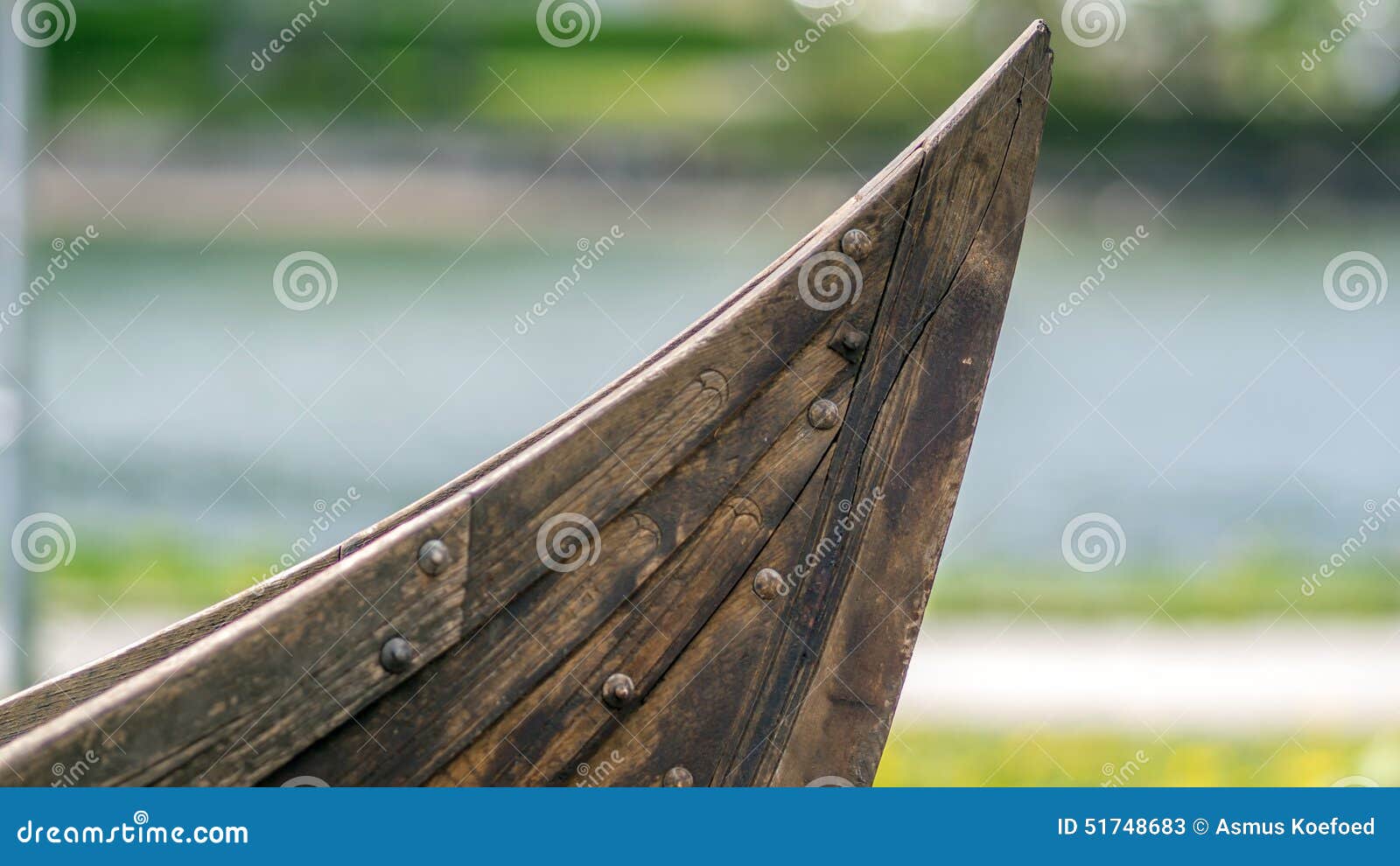 Small viking ship like boat bow showing the clinker built hull.