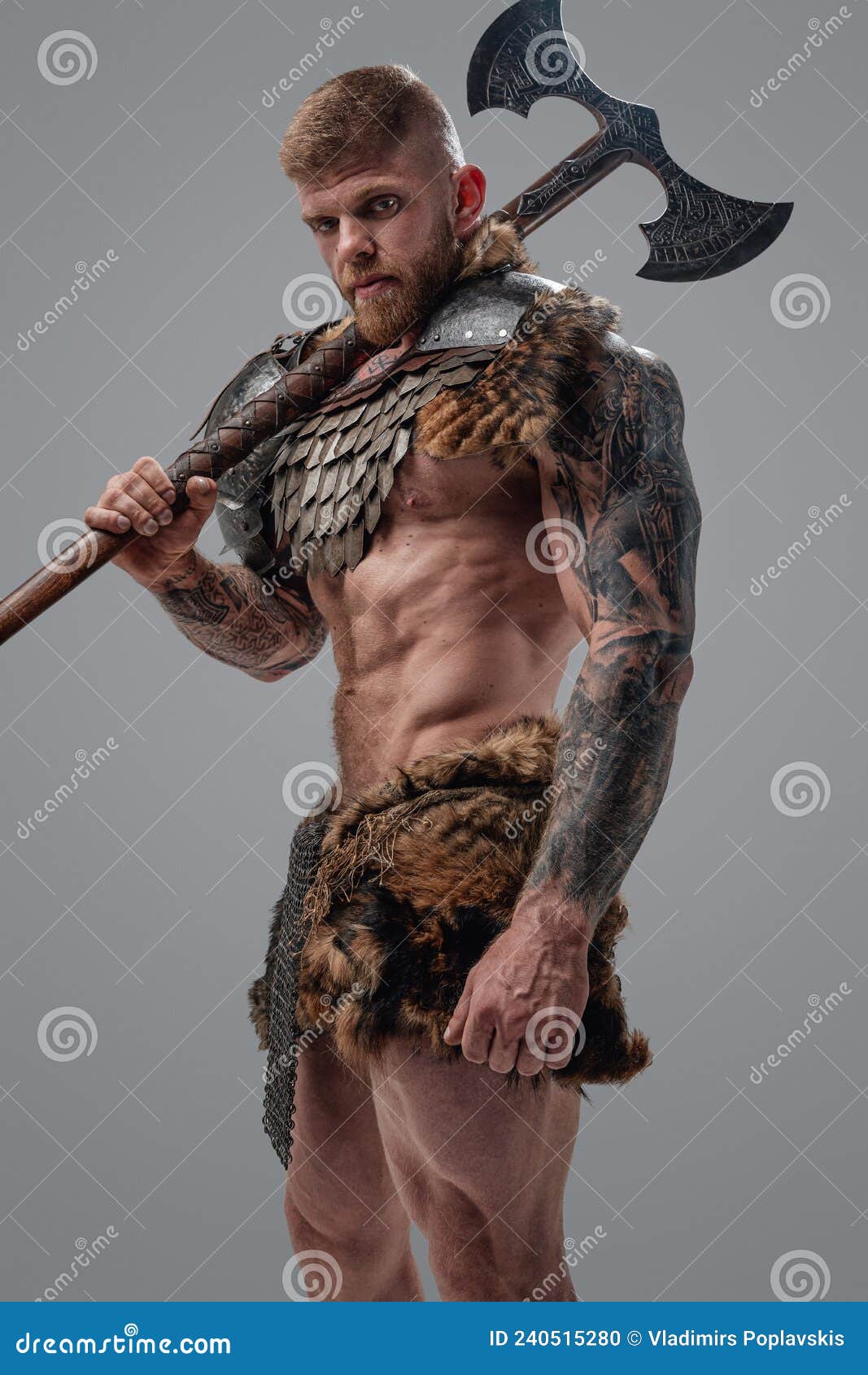 Violent Viking With Muscular Build And Axe On His Shoulder Stock Photo