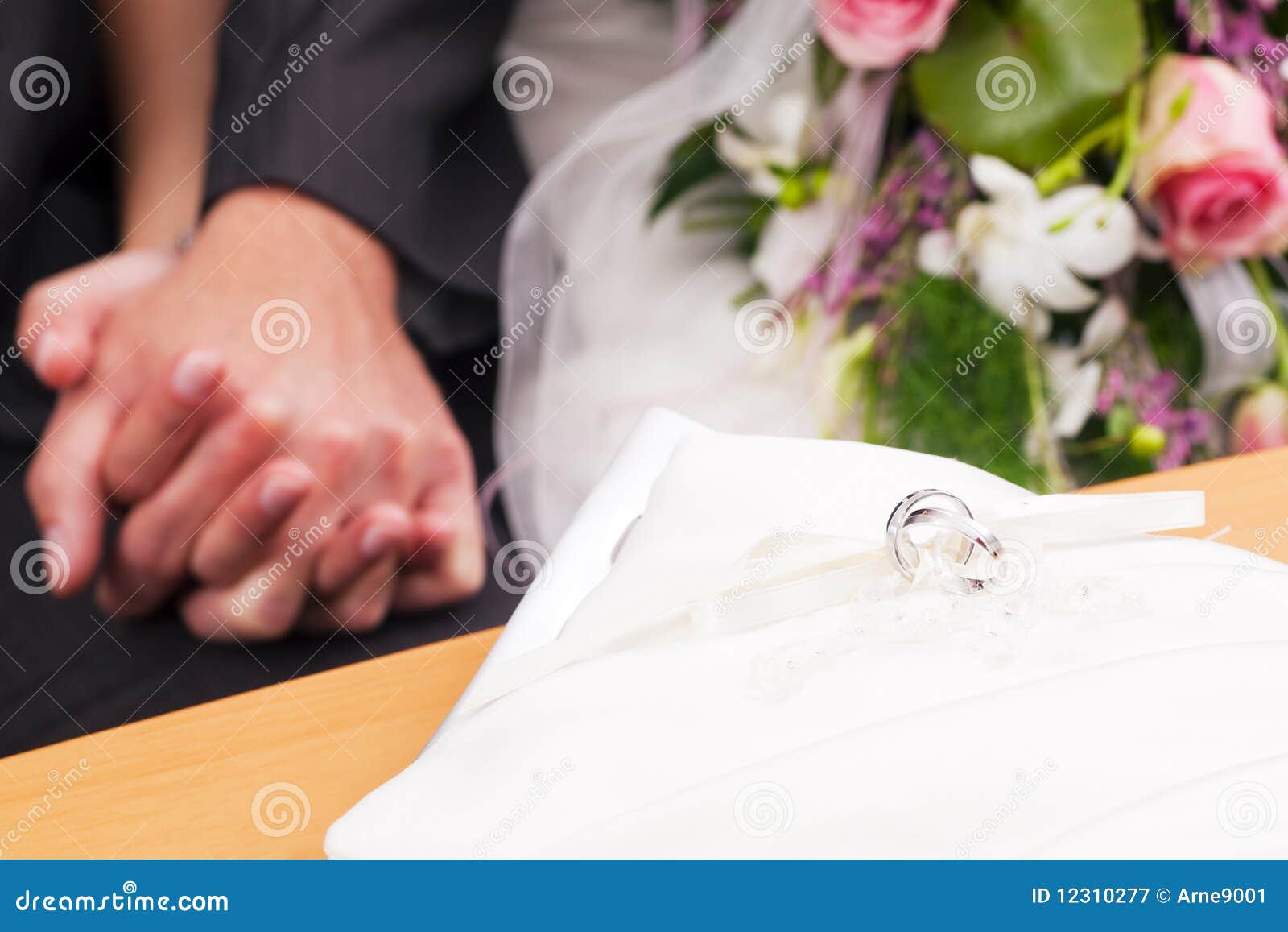 ... rings in front of the couple to be wed, picture of a wedding ceremony