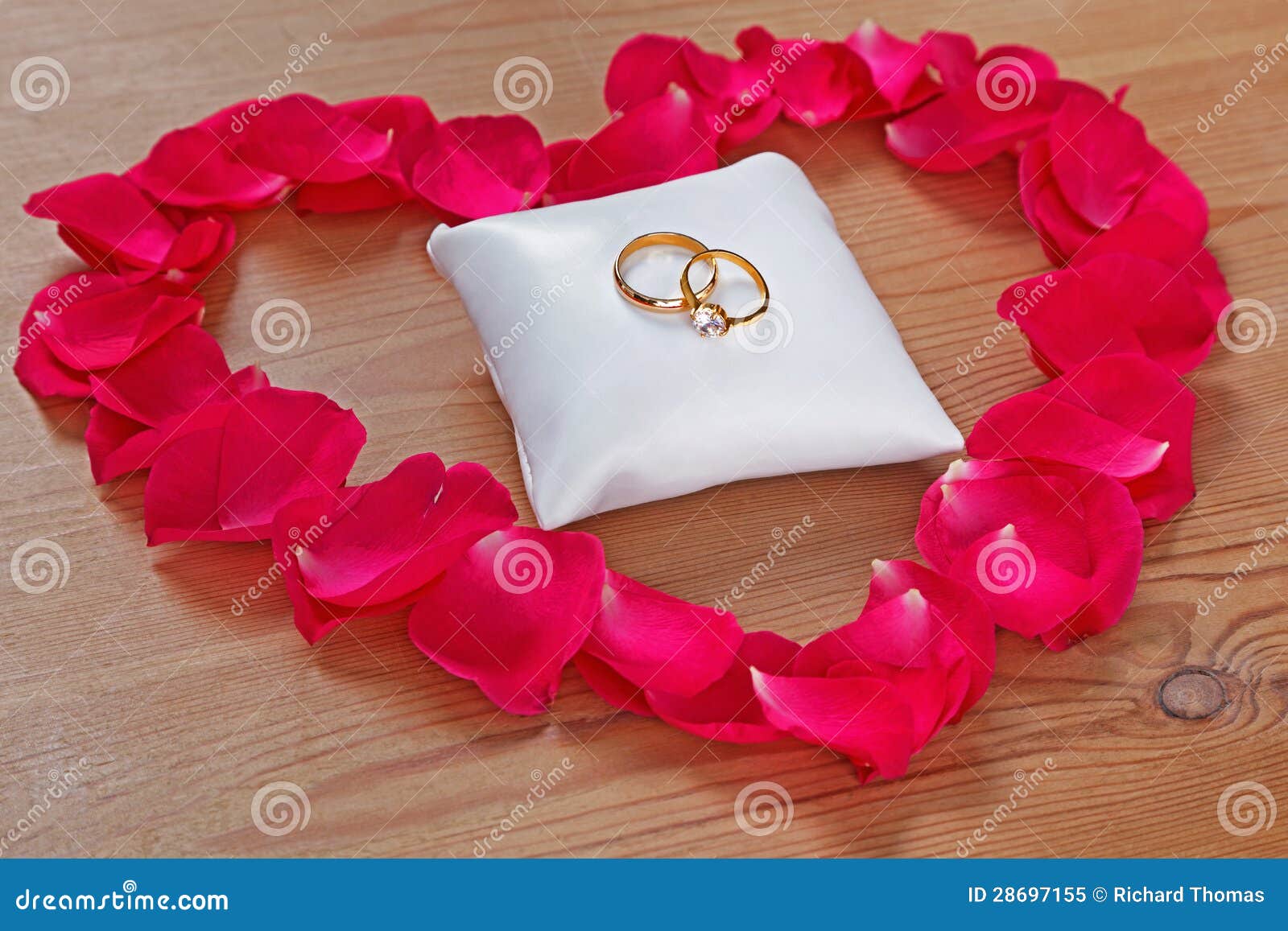 wedding rings on single rose petal
