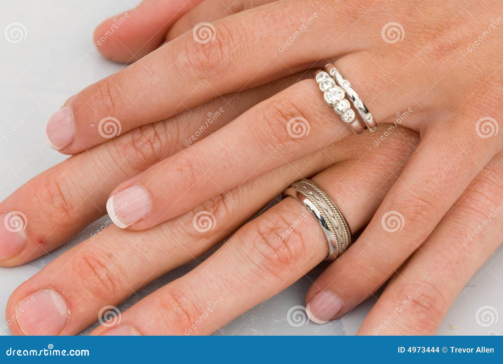 Stock Images: Wedding Rings on hands