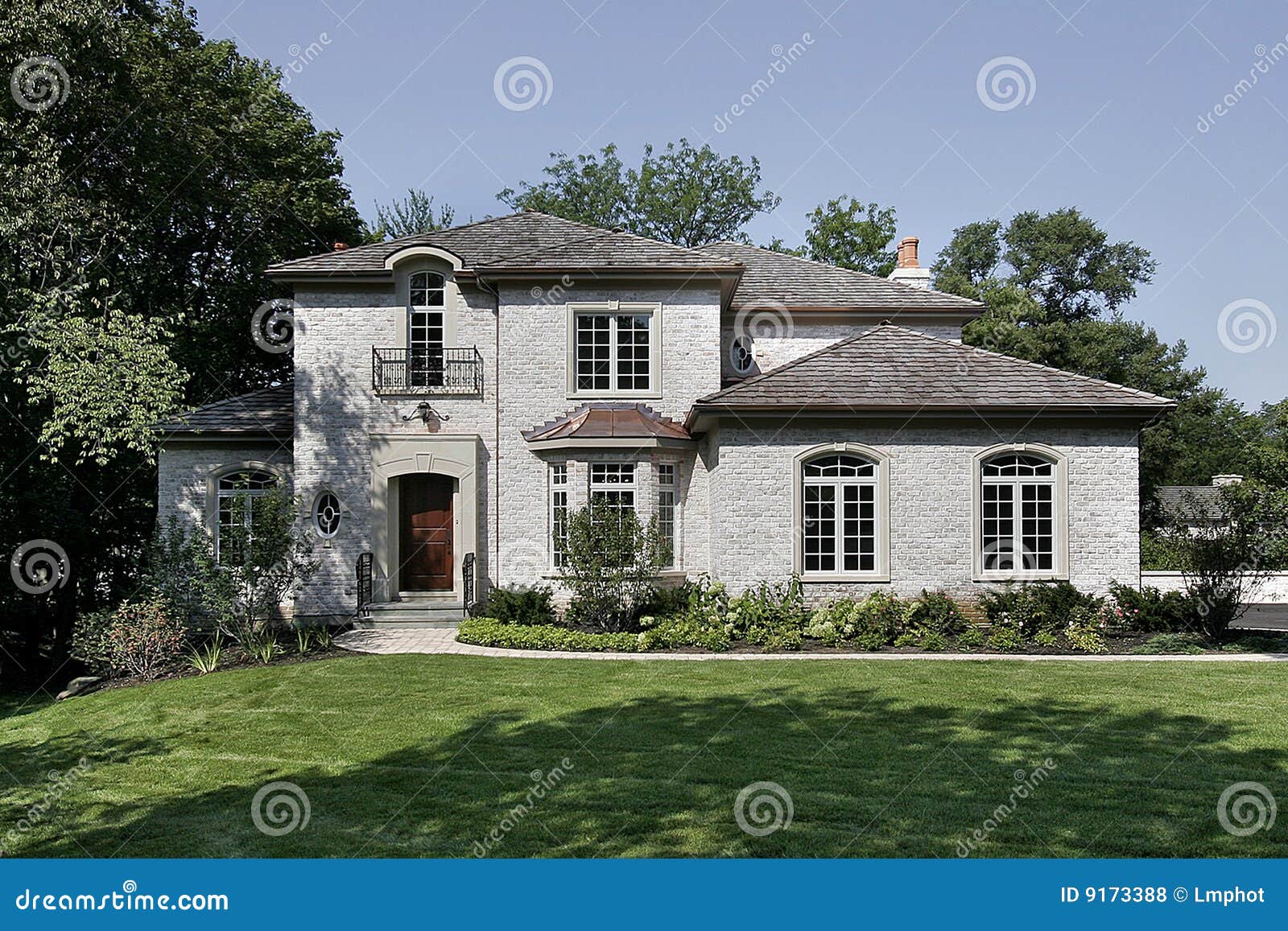 White Brick Home with Cedar Shake Roof