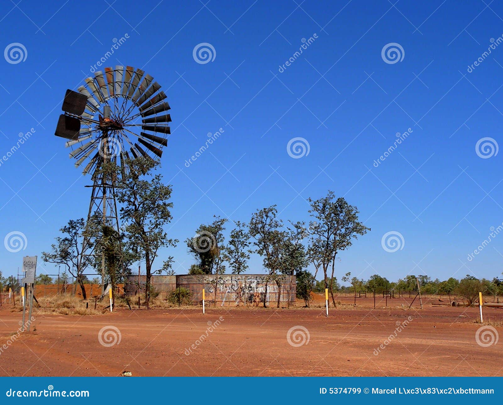 Wind Mill Water Pump With Tank Royalty Free Stock Images - Image 