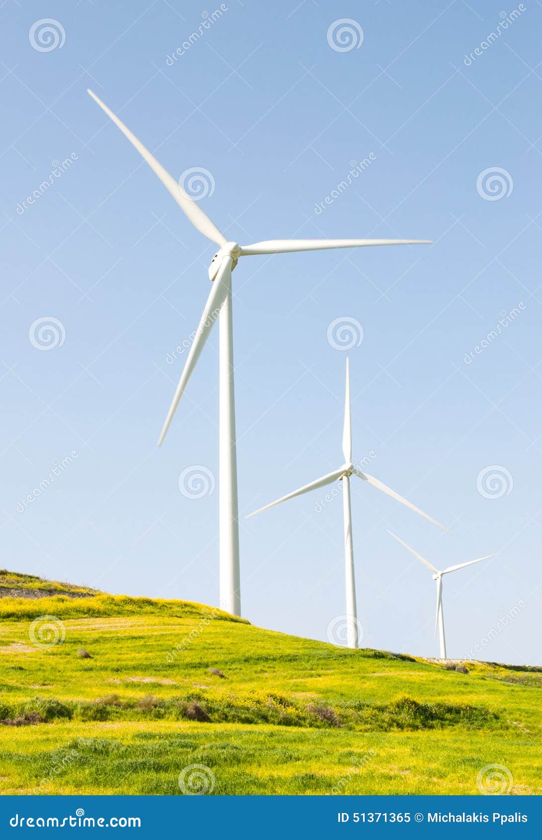 power generators on a turbine farm generating electricity from wind