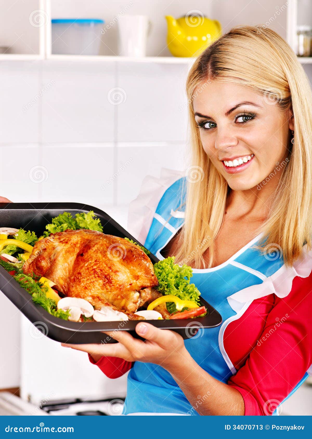 woman-cooking-chicken-kitchen-young-34070713.jpg