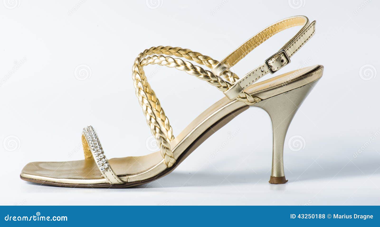 Stock Photo: Woman golden shoes on white
