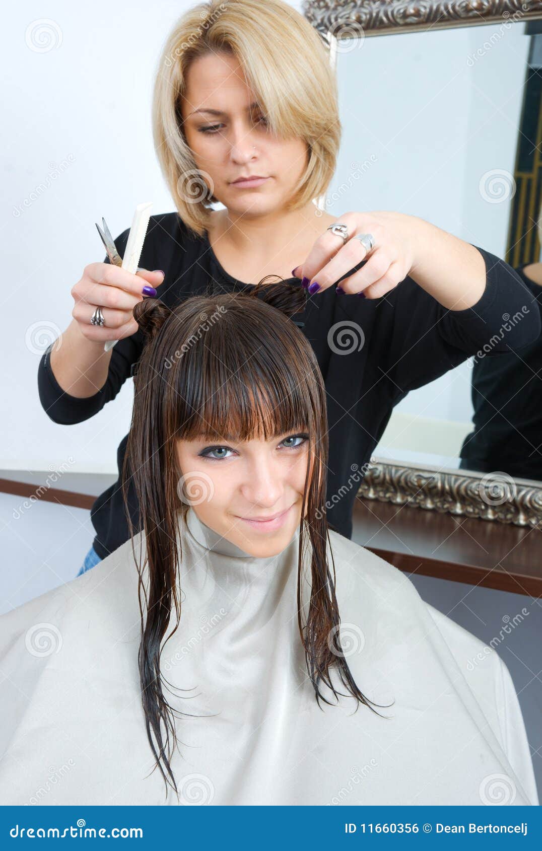 Woman with wet hair in hair salon having treatment.