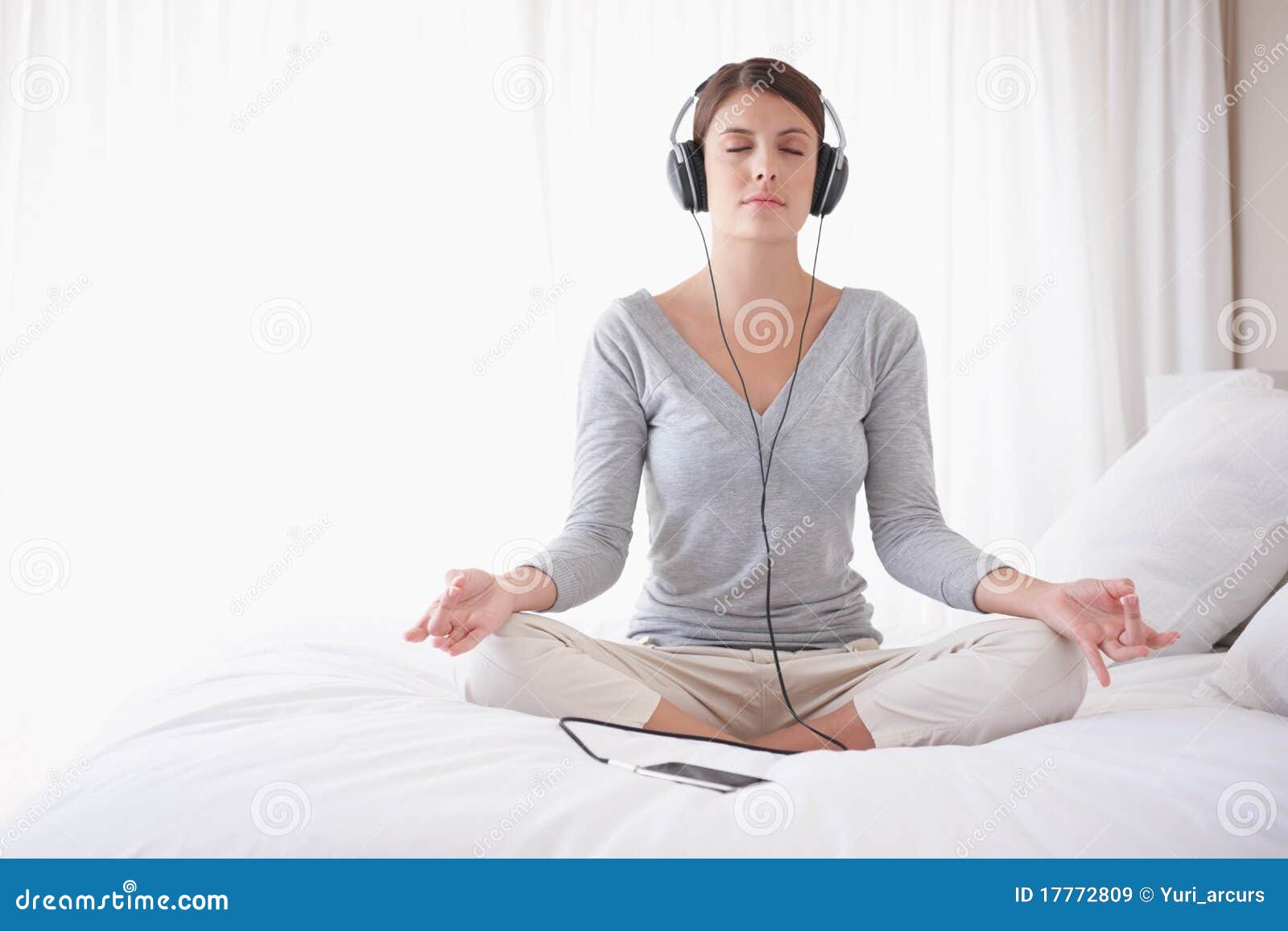 Royalty Free Stock Images Woman With Headphones In Lotus Position On Bed Image 17772809