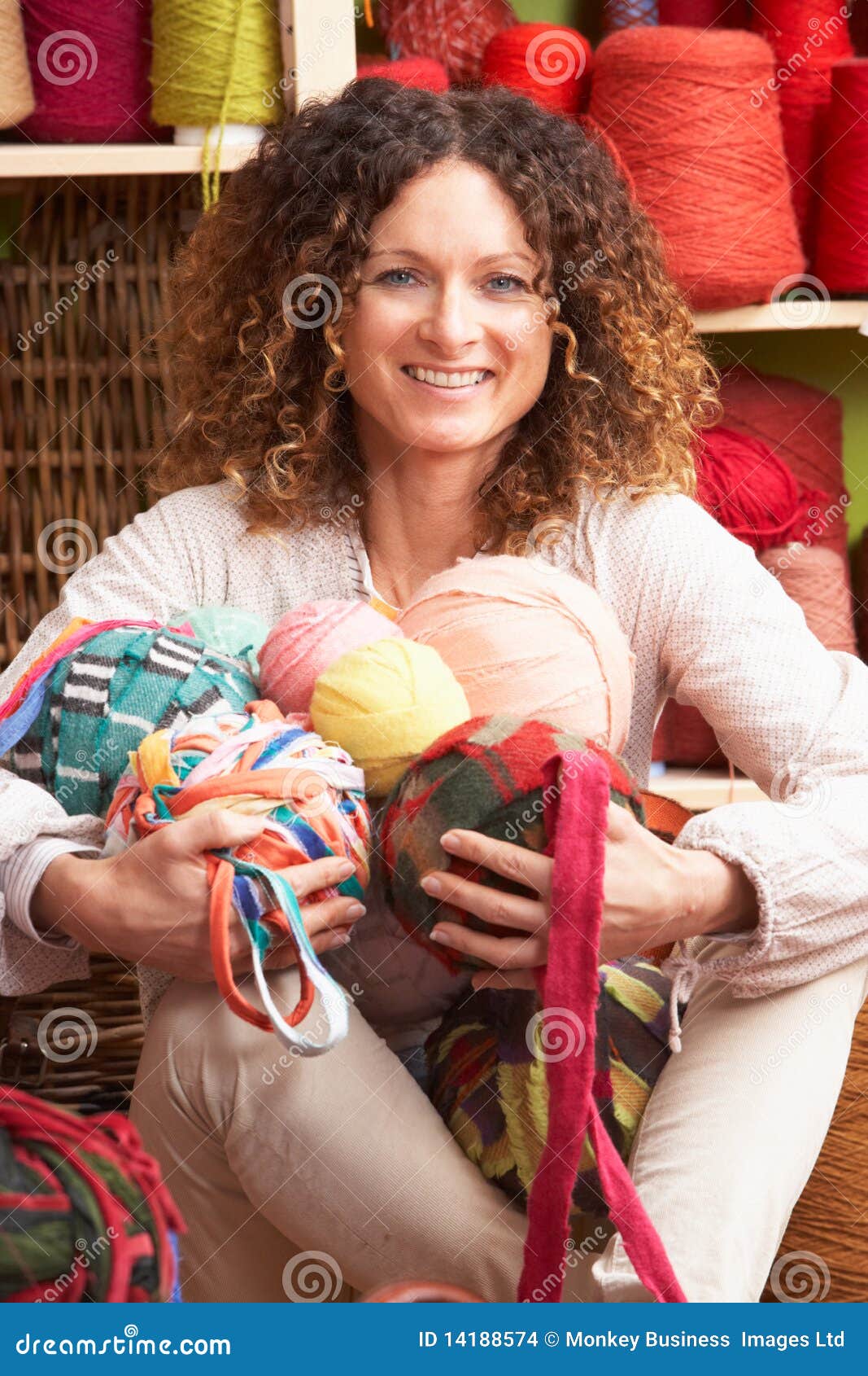 woman holding balls of wool in front of yarn stock images gingerbread house plan