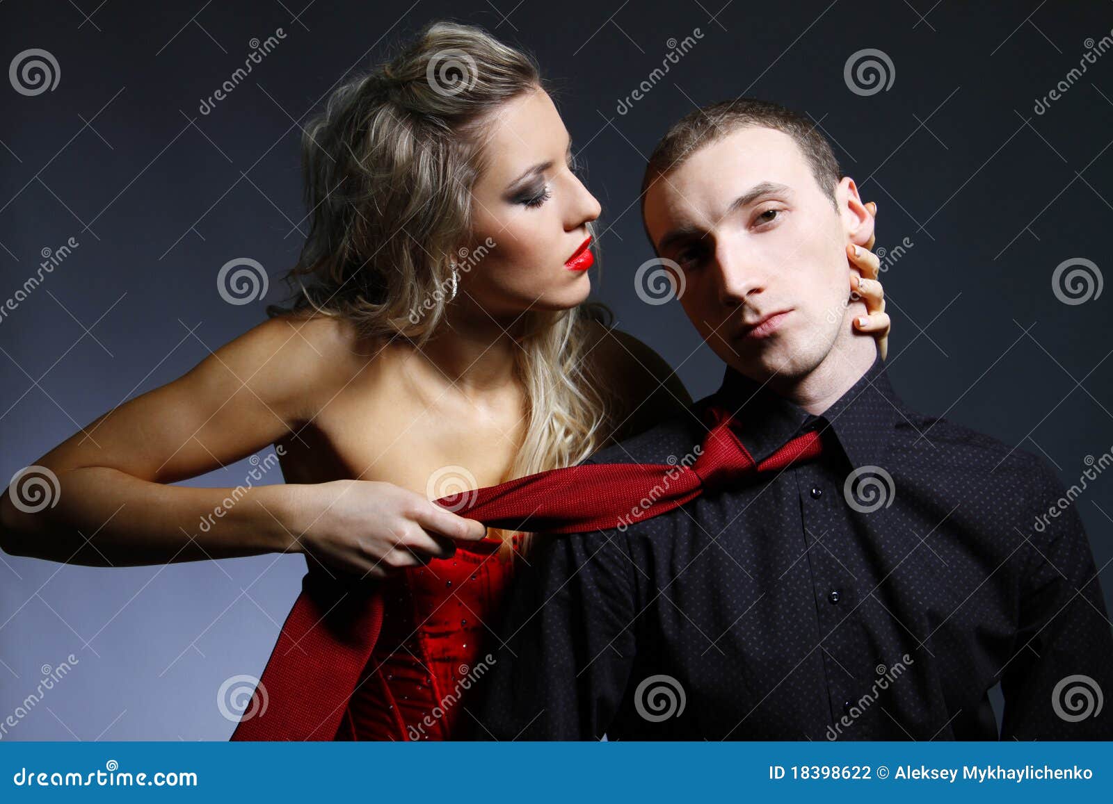http://thumbs.dreamstime.com/z/woman-holding-man-tie-18398622.jpg