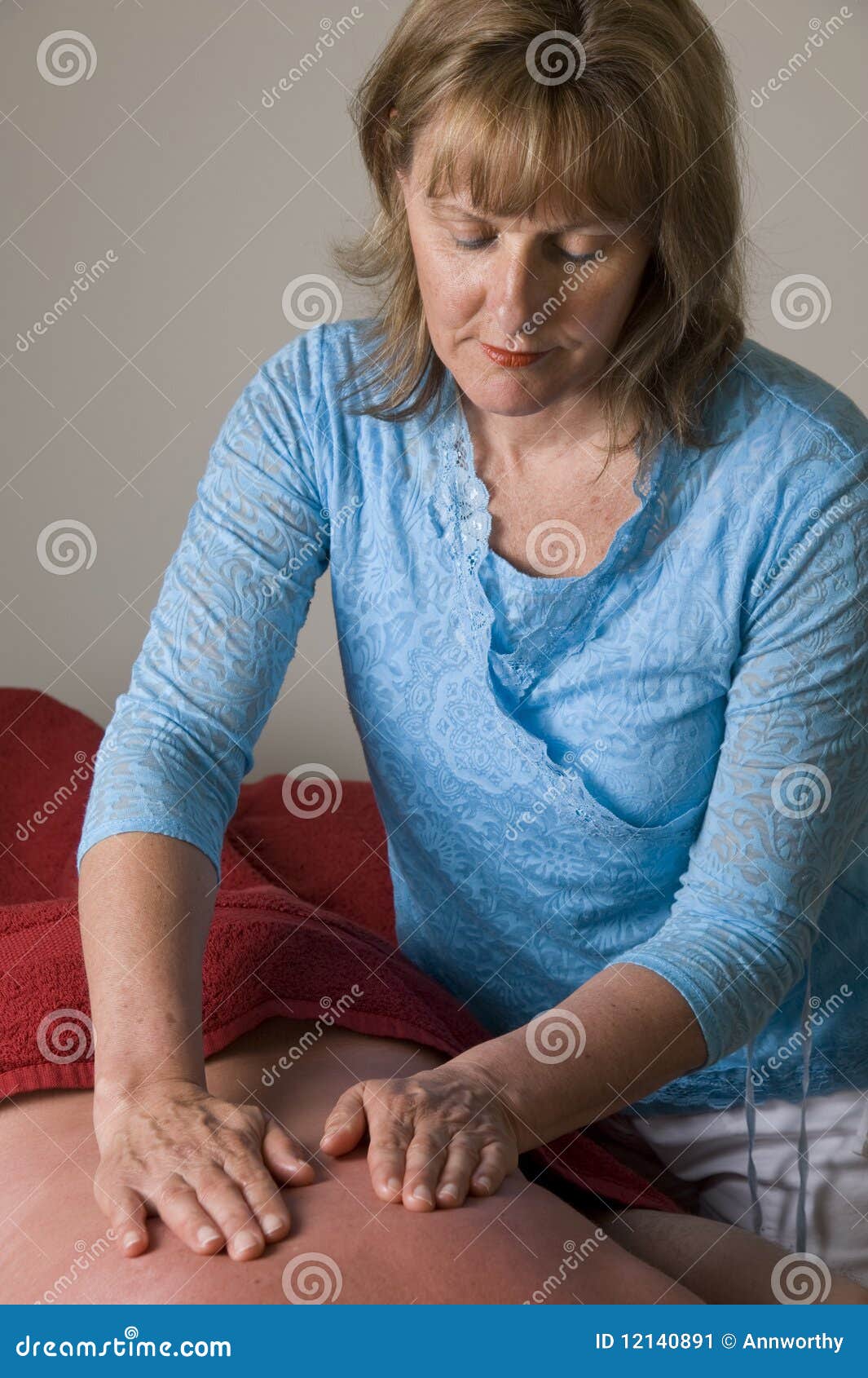 Woman Massaging Mans Back Stoc