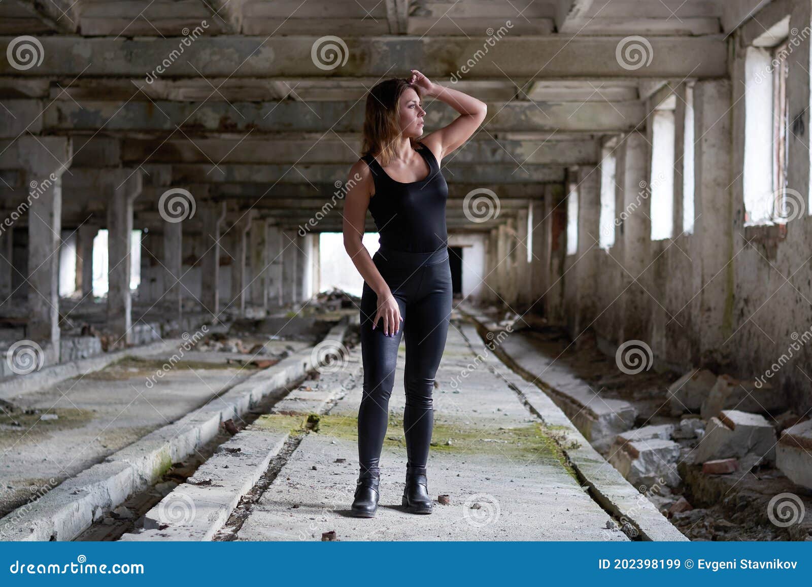A Woman On The Ruins In A Ruined City With Garbage Stock Image Image