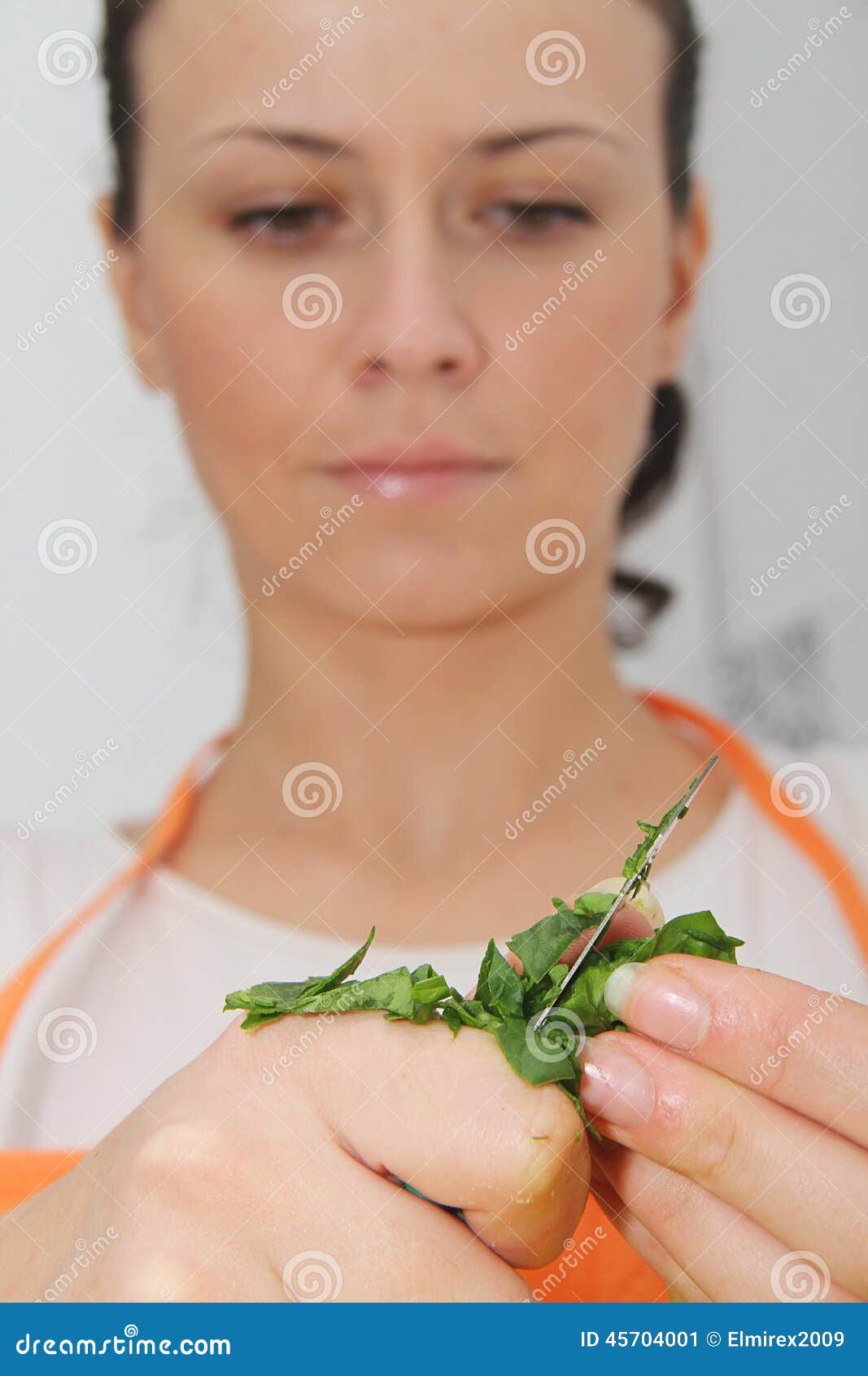 Woman with a spinach in a <b>modern kitchen</b> - woman-spinach-modern-kitchen-photo-45704001