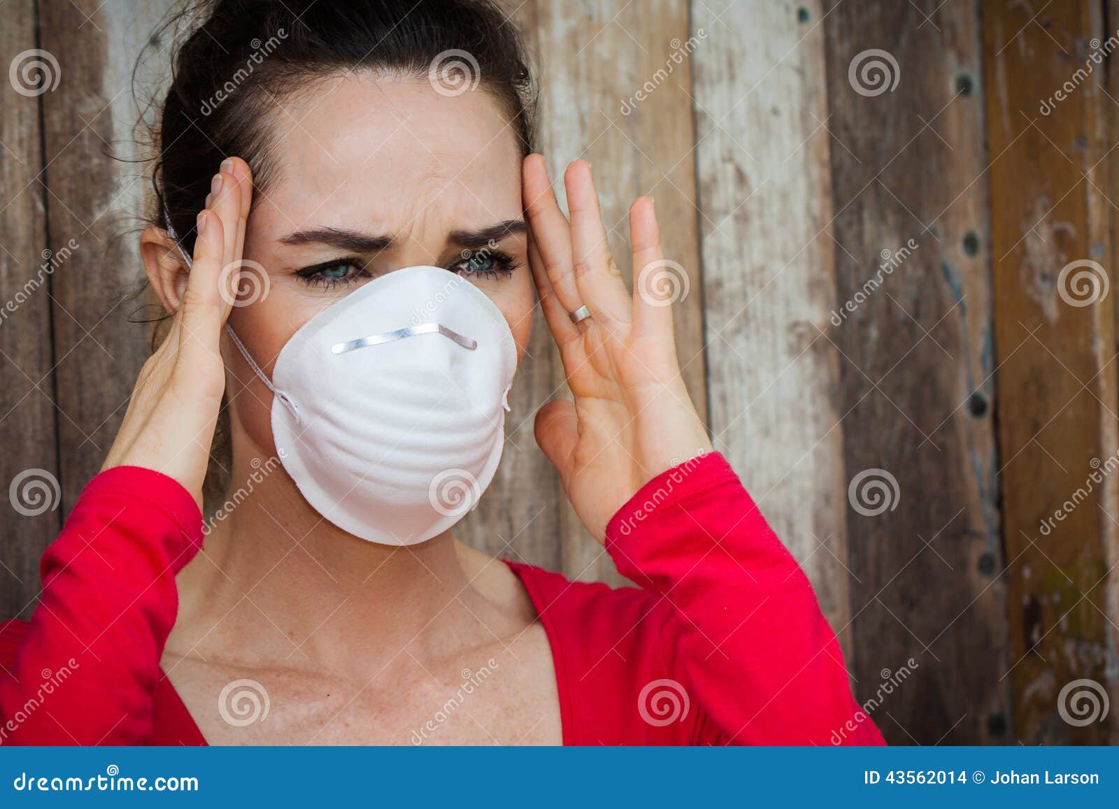 Woman Wearing A Face Mask Has A Headache Stock Photo - Image: 43562014