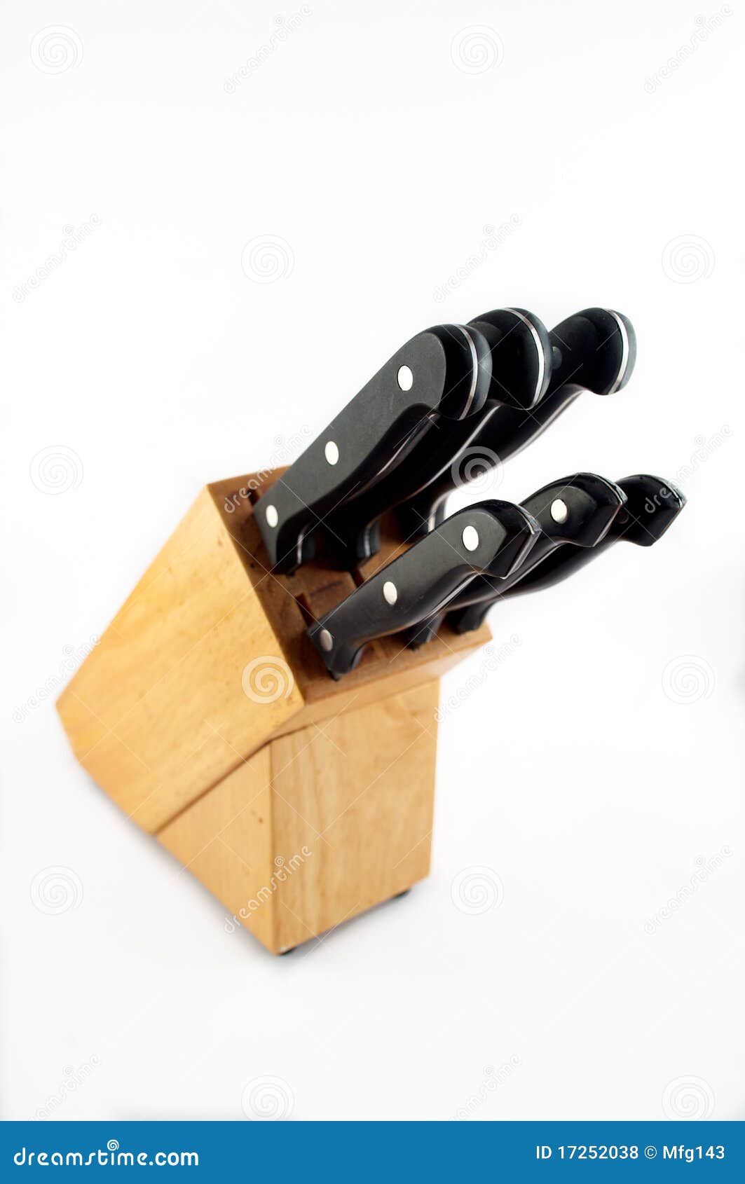 Set of steel knives in a wooden block.