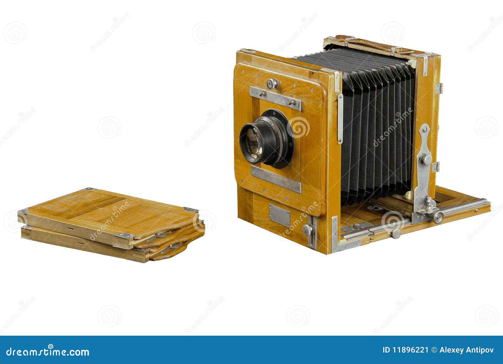 Vintage wood box photo camera and two plate holders on white 