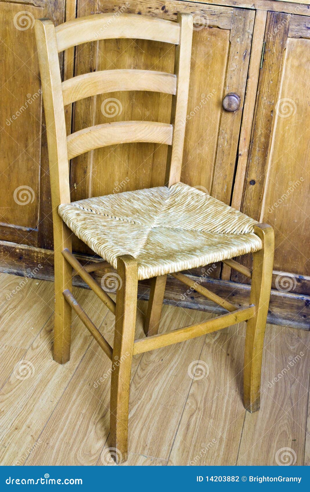 simple wooden and wicker kitchen chair set in s rustic kitchen.