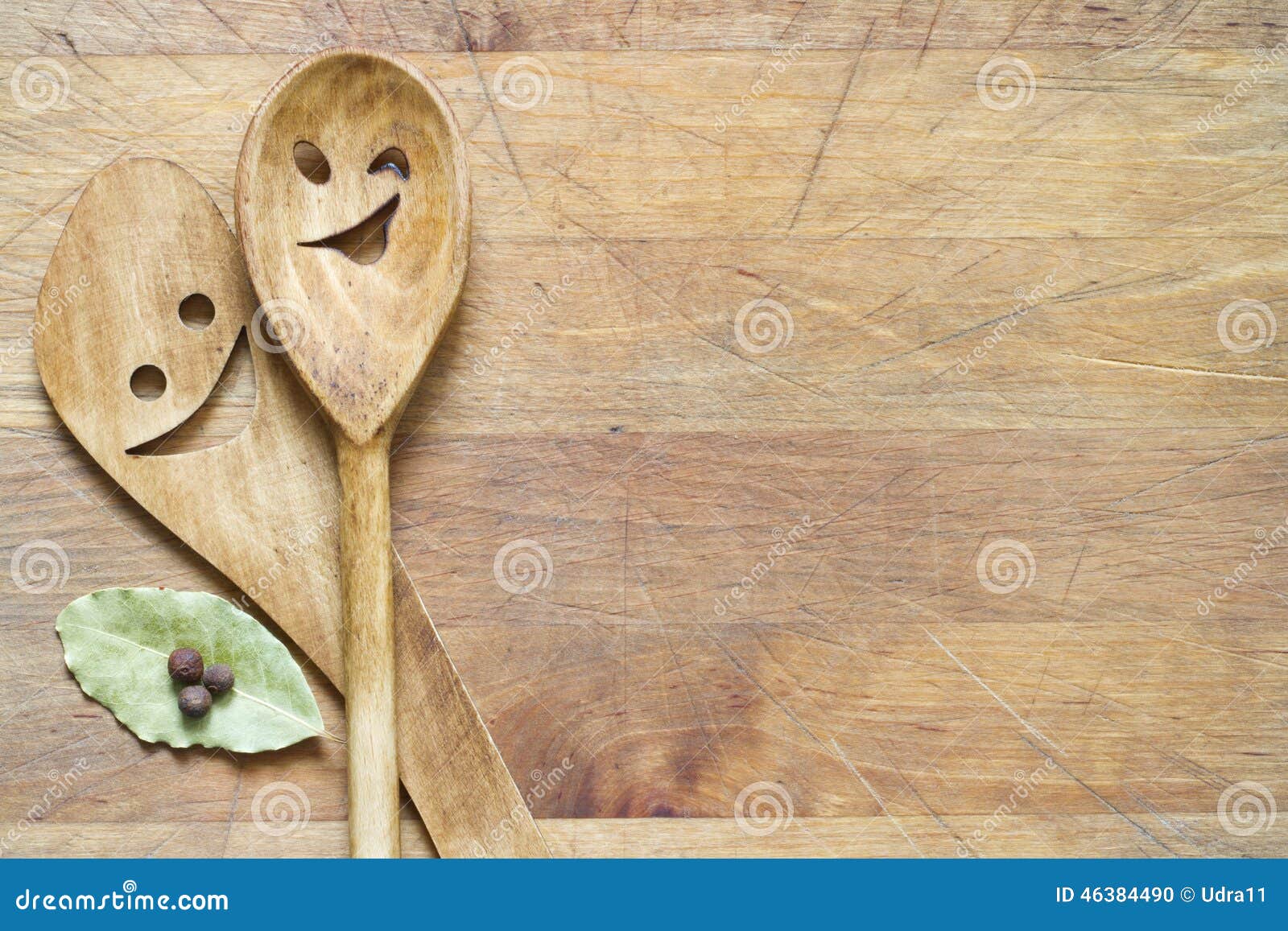 Wooden kitchenware on cutting board abstract food background.