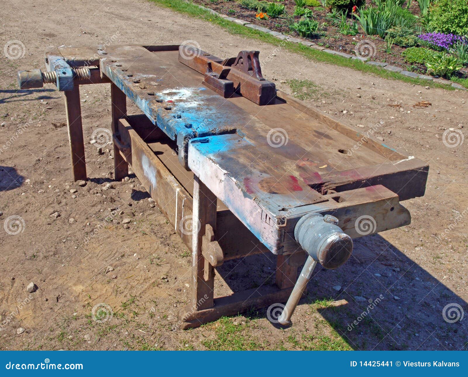 Old retro woodworking bench with carpenter tools.