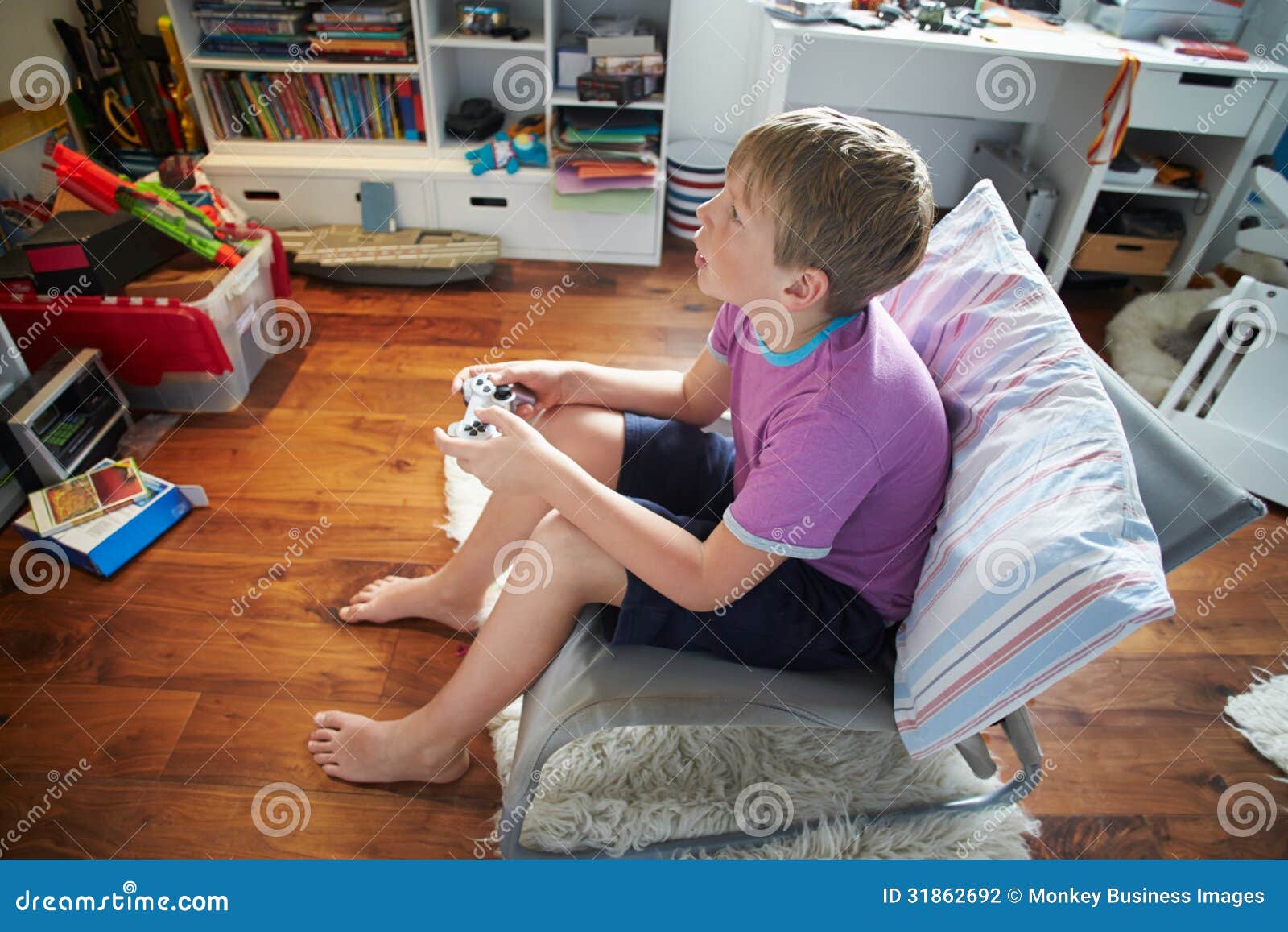 Young Boy Playing Video Game In Bedroom Stock Photography - Image ...