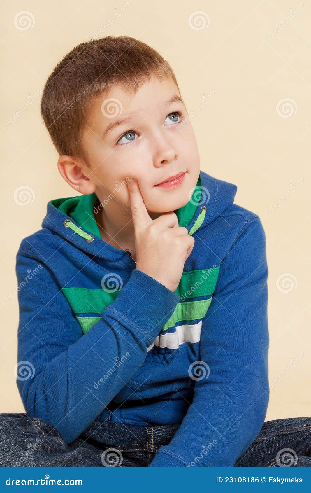 Young Cute Boy Sitting And Thinking. Royalty Free Stock Image - Image