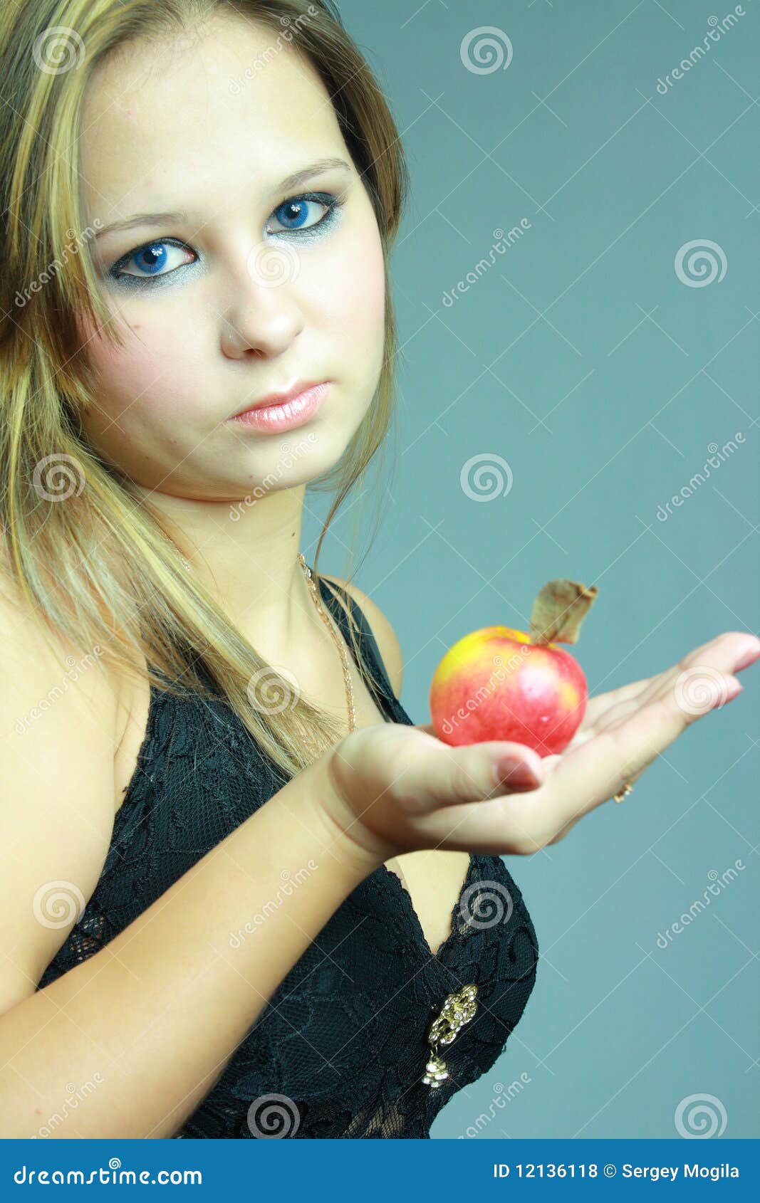 Young girl keeps on palm apple - young-girl-keeps-palm-apple-12136118