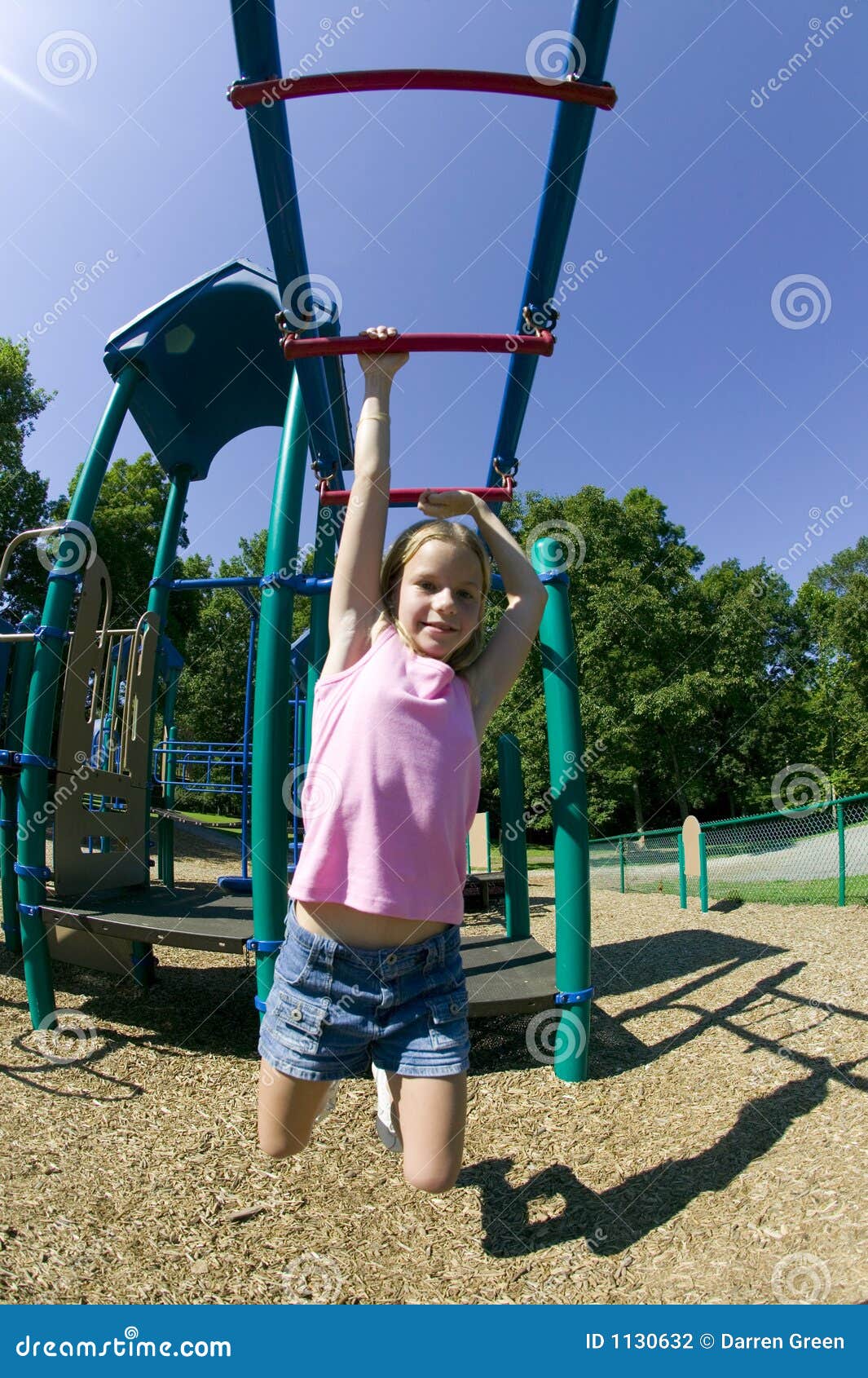 Young Girl Playing On Monkey Bars At The Park Stock Image 