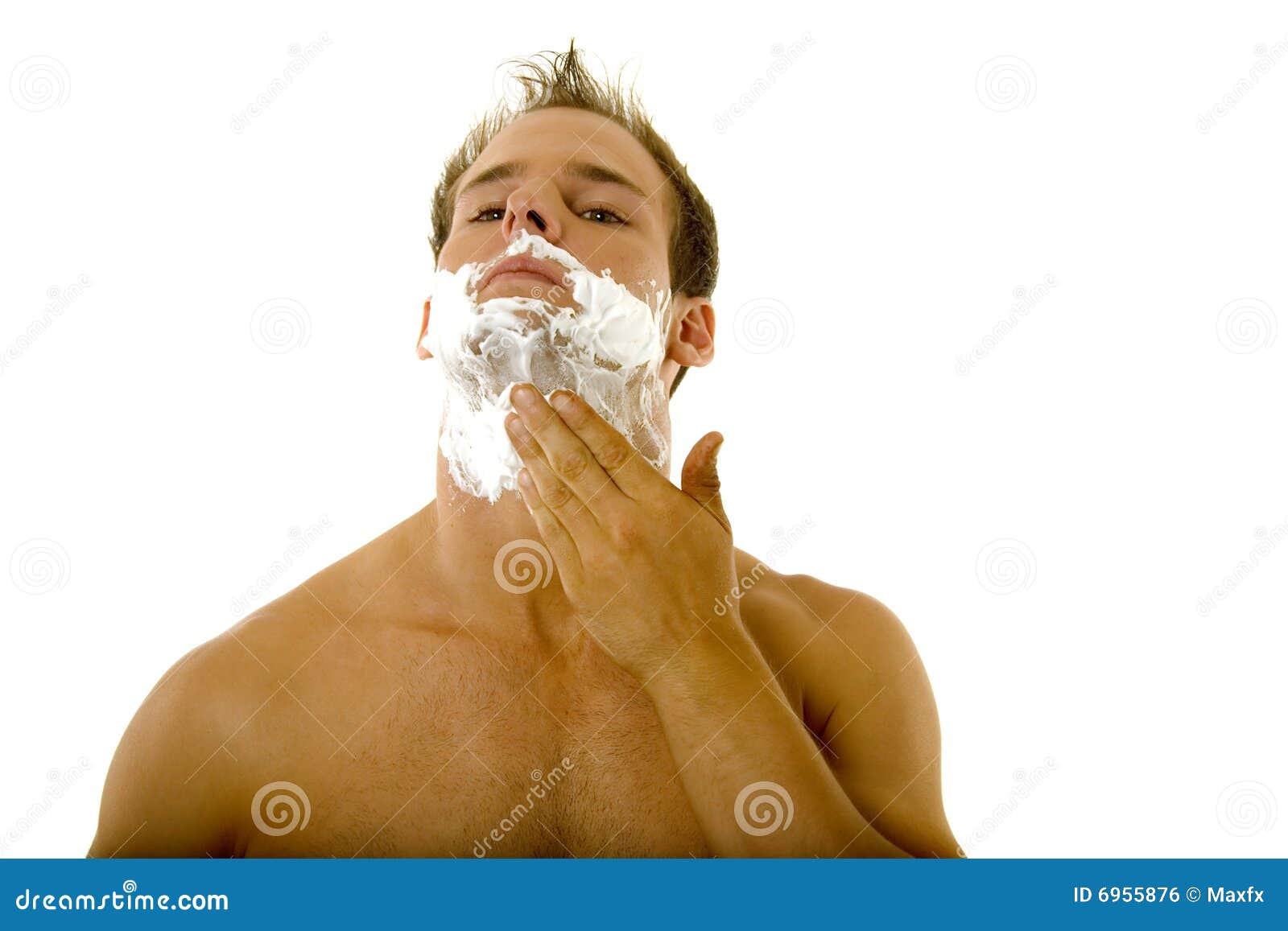 Young Man Applying Shaving Cream To His Face Royalty Free Stock Image
