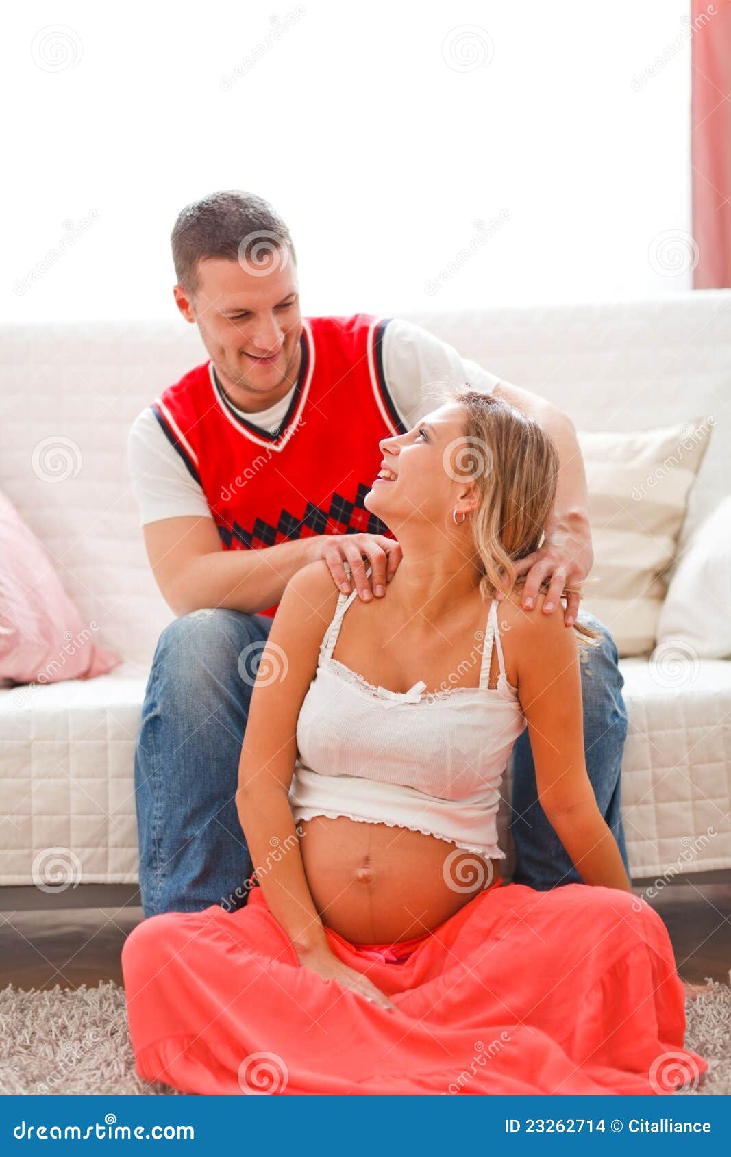 Young Man Making Massage His Preg