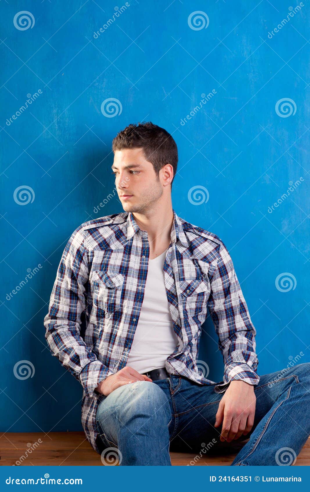 Young Man With Plaid Shirt Denim Jeans In Blue Stock Image - Image