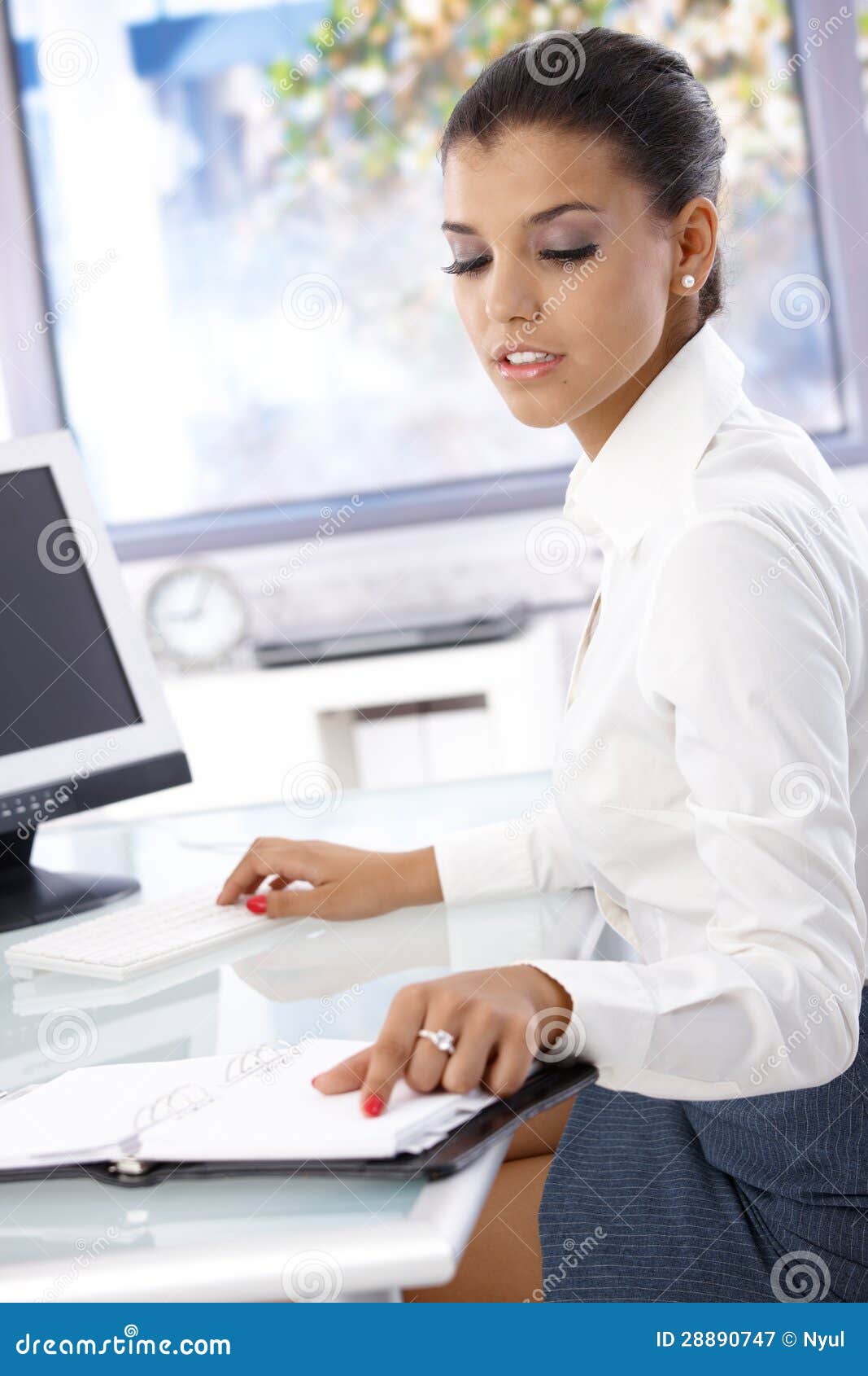 Young Office Worker Sitting At Desk Royalty Free Stock
