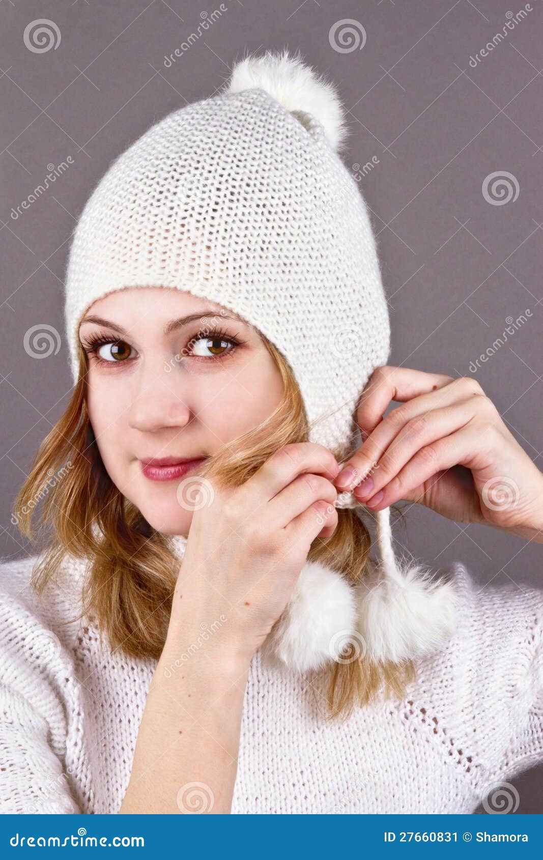 Young Woman In A White Knitted Cap Grey Stock Image ...