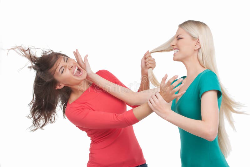 Противостояние двух женщин. Женское Противостояние. Женщина в гневе. Женская драка стоковое фото.