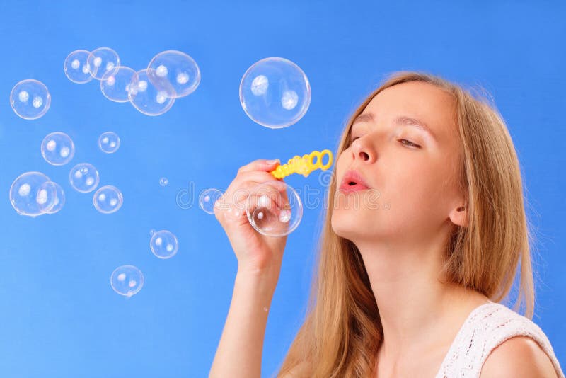 Little Cute Girl Blowing Soap Bubbles Stock Image