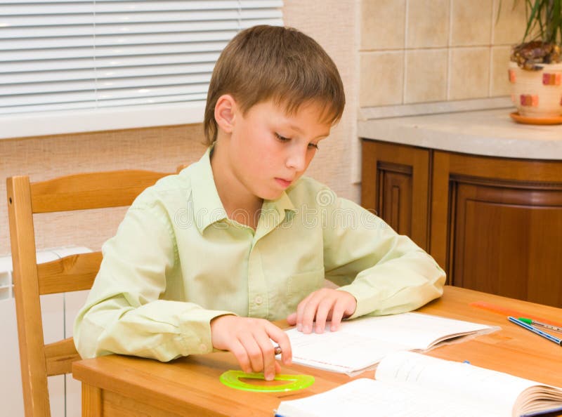 Мальчик на уроке. Мальчик в деревне делает уроки. Doing his homework. Мама проверяет уроки у мальчика.