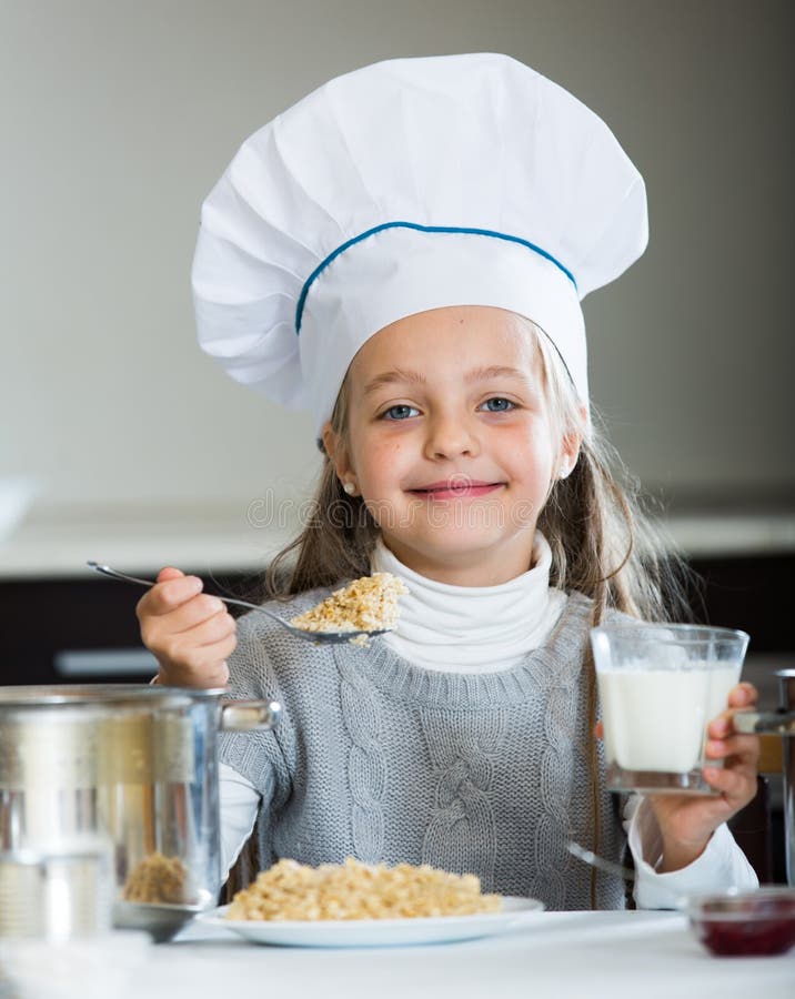 Girl serve porridge