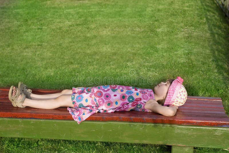 Girl Lying On Her Back On The Floor Looking Up Stock Photo - Download Image Now