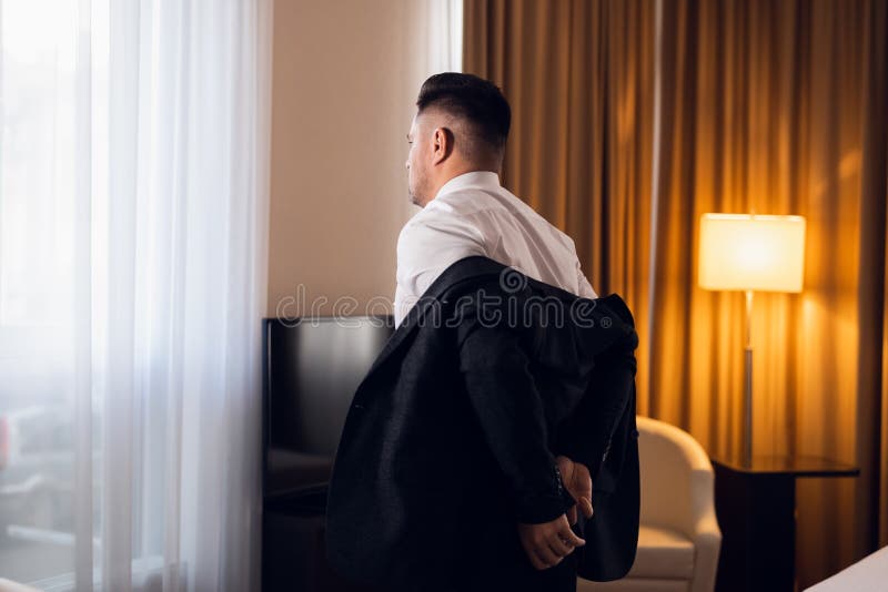 Take off Jacket. To take off a Coat. The Corpse of a young businessman in a Suit in a Hotel Room.