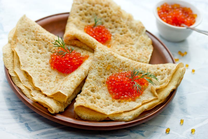 Блины с медом и икрой сверху