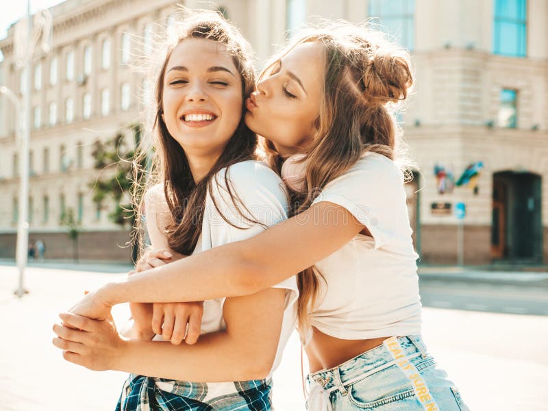 Two girl 18. Two girls kissing. Young women friends smiling. Portrait two girls Outdoor. Two girls having fun 3.