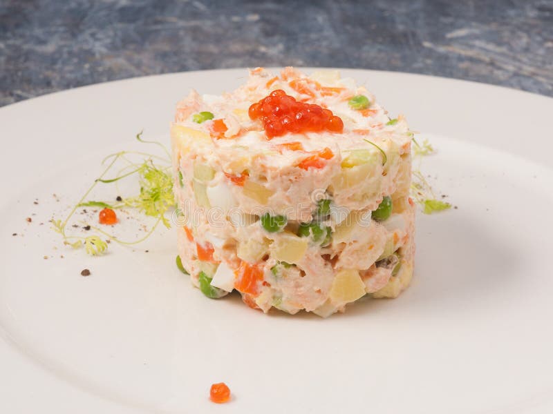 Оливье с семгой и красной икрой