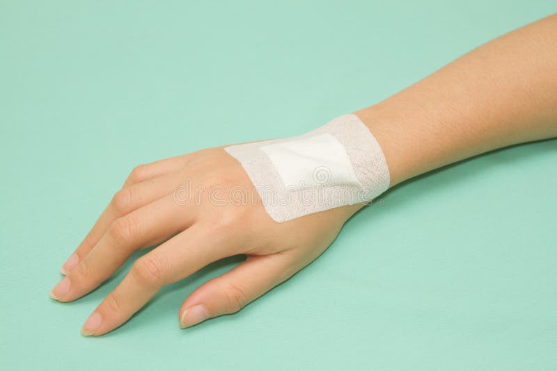 Белые повязки на руках и ногах. Белая повязка на руке. Plaster on hand. Stickers made of Adhesive Plaster to prevent overstretching of the affected muscles.