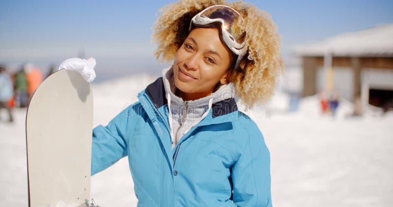 Man holding Snowboard Side