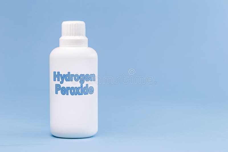 一种英文书写的塑料容器药瓶 双氧水突显的蓝色背景概念库存图片 图片包括有英语 玻璃
