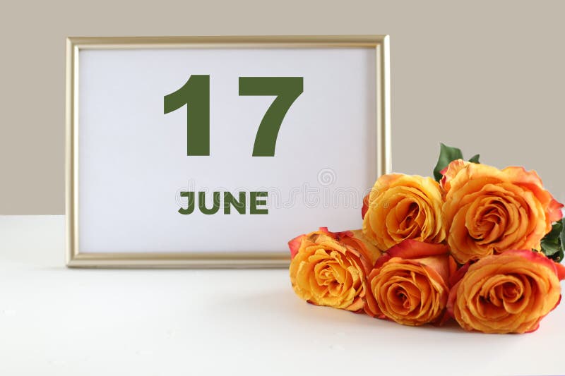 6月17日日历照片框和白桌上的黄色玫瑰库存图片 图片包括有设计 节假日 背包 活动 符号