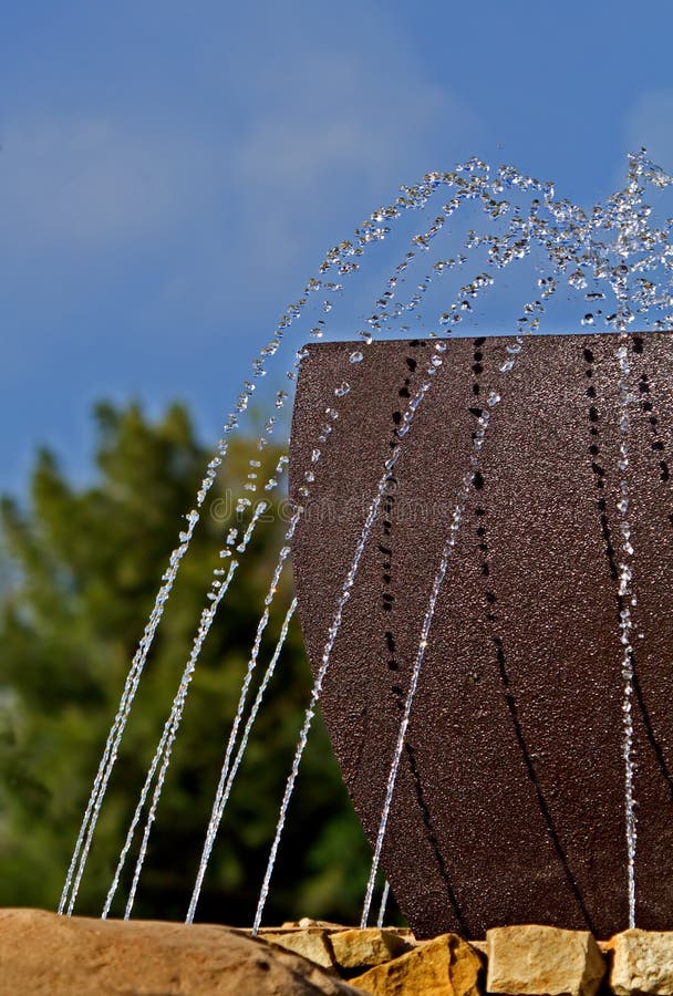 Artistic portrait of a water feature in an outdoors setting. Artistic portrait of a water feature in an outdoors setting