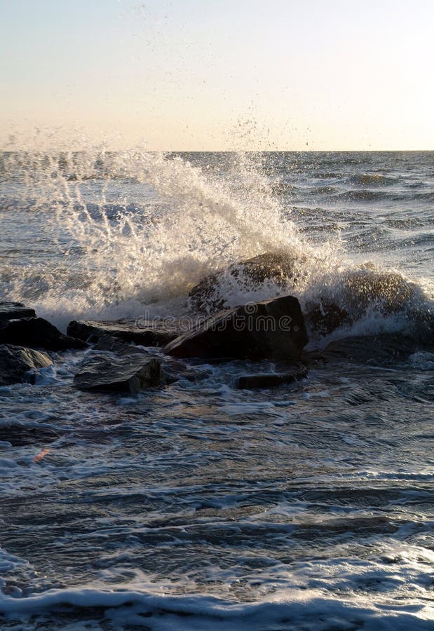 Waves crash against the rocks. Waves crash against the rocks.